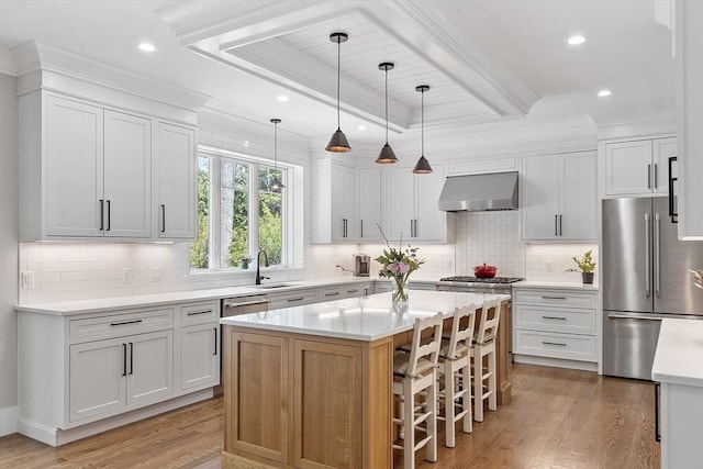 306 Laws Brook Rd, Concord, MA 01742 - kitchen with high end fridge, exhaust hood, a sink, light wood-type flooring, and a breakfast bar