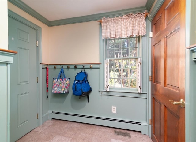 entryway featuring a baseboard heating unit and ornamental molding