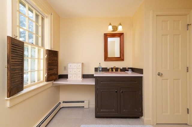 bathroom featuring a baseboard radiator, tile patterned floors, and vanity