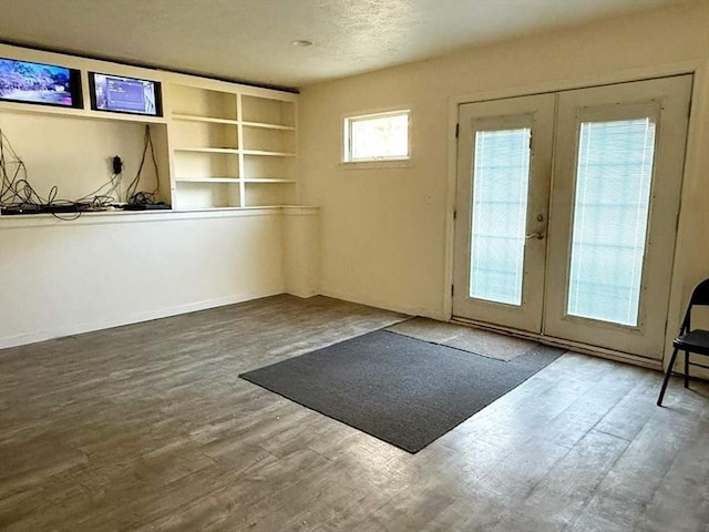 doorway to outside with french doors and hardwood / wood-style floors