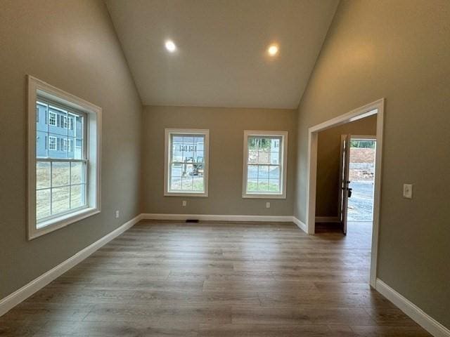 empty room featuring dark wood-style floors, recessed lighting, and baseboards