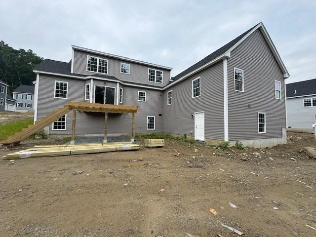 rear view of property with stairway