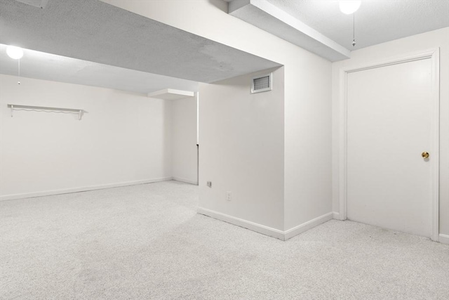 finished below grade area featuring carpet floors and baseboards
