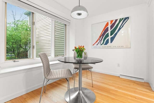 dining area featuring wood finished floors and baseboards