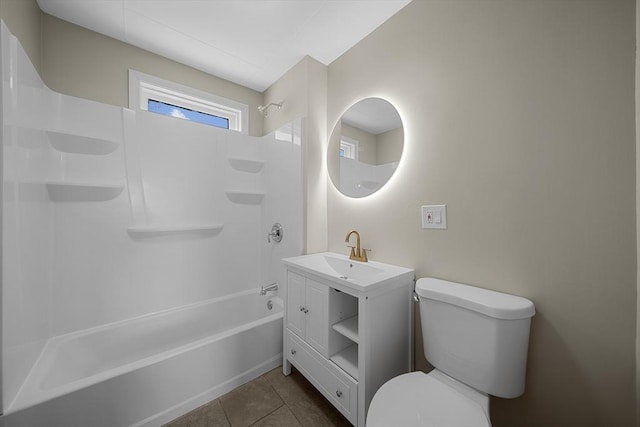 bathroom with vanity, tile patterned floors, toilet, and shower / bathtub combination