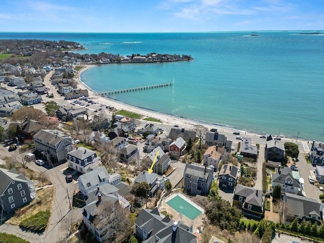 bird's eye view with a water view, a residential view, and a view of the beach
