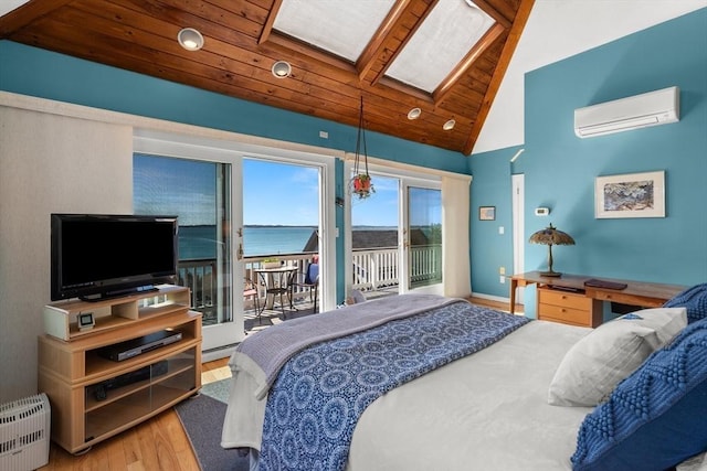 bedroom with a wall unit AC, baseboard heating, wooden ceiling, wood finished floors, and access to outside