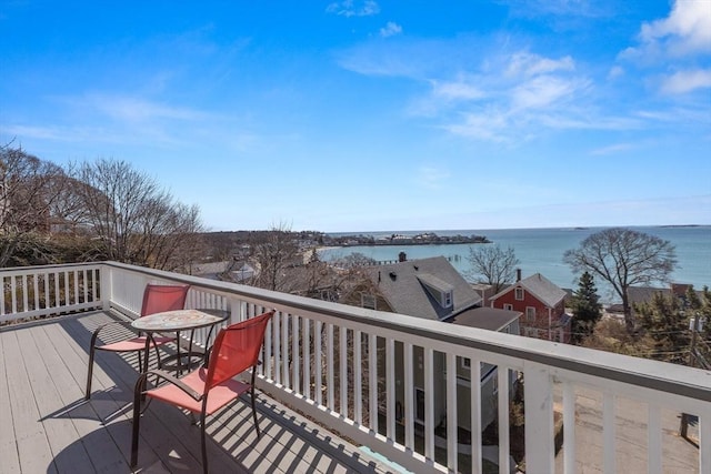 wooden deck with a water view