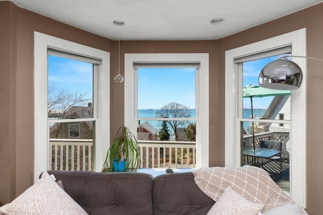 interior space featuring a water view and a wealth of natural light