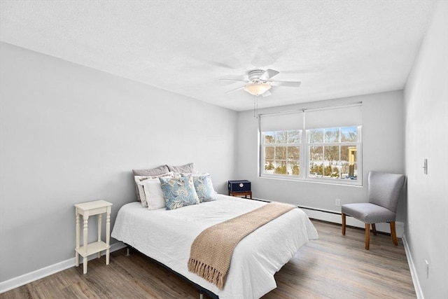 bedroom featuring dark hardwood / wood-style flooring and ceiling fan