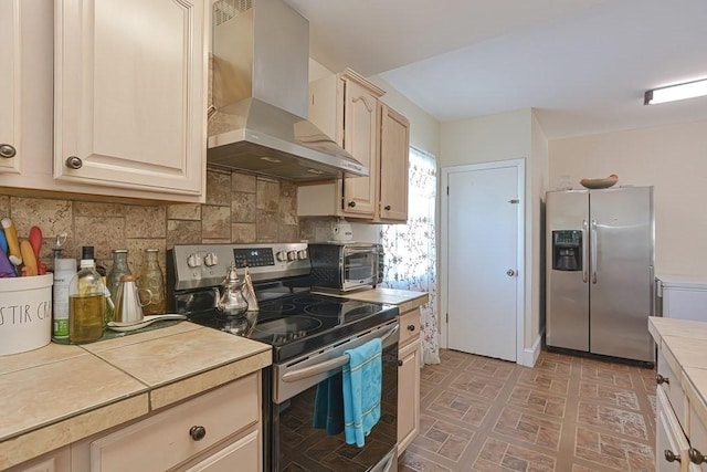 48 Tappan St, Everett, MA 02149 - kitchen with stainless steel appliances, wall chimney range hood, and tasteful backsplash