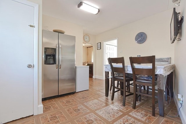 48 Tappan St, Everett, MA 02149 - dining space with baseboards and arched walkways