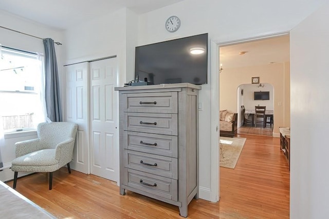 48 Tappan St, Everett, MA 02149 - living area with light wood-style flooring and arched walkways