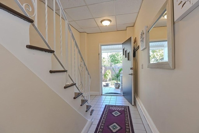 48 Tappan St, Everett, MA 02149 - entryway with a drop ceiling, stairs, light tile patterned flooring, and baseboards