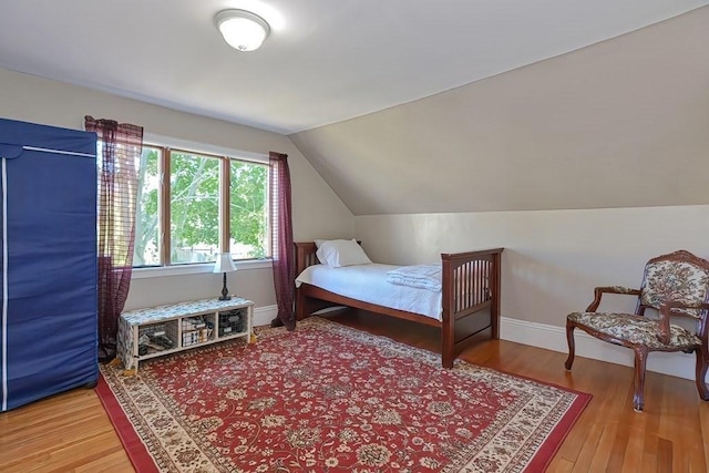 48 Tappan St, Everett, MA 02149 - bedroom with lofted ceiling, wood finished floors, and baseboards