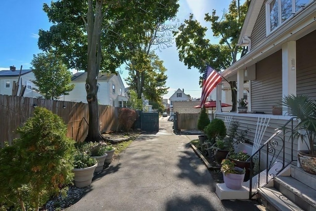 48 Tappan St, Everett, MA 02149 - view of property exterior featuring fence, a residential view, and a patio