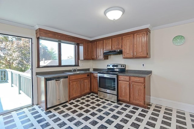 48 Tappan St, Everett, MA 02149 - kitchen with stainless steel appliances, under cabinet range hood, dark countertops, and light floors