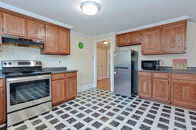 48 Tappan St, Everett, MA 02149 - kitchen featuring appliances with stainless steel finishes, under cabinet range hood, dark countertops, light flooring, and ornamental molding