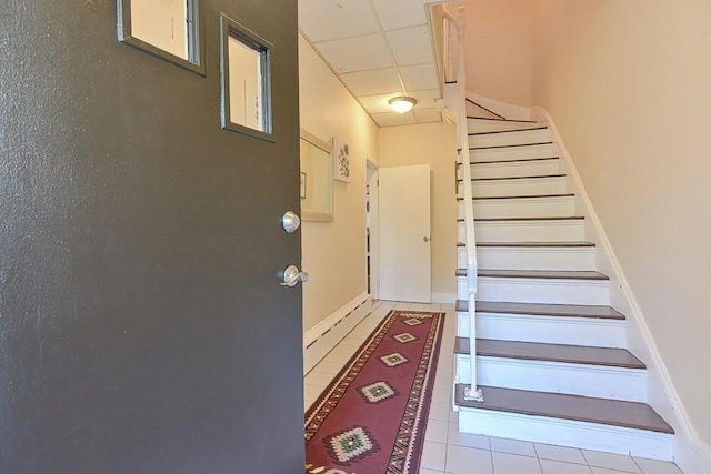 48 Tappan St, Everett, MA 02149 - staircase featuring tile patterned floors, baseboards, and a paneled ceiling
