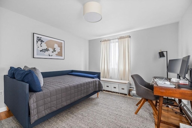 bedroom featuring wood finished floors