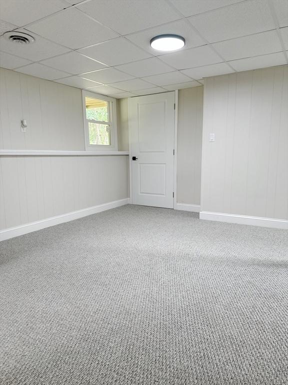 17 Kingsley Rd, Norton, MA 02766 - below grade area with a paneled ceiling and carpet