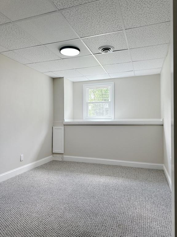 17 Kingsley Rd, Norton, MA 02766 - below grade area with a paneled ceiling and carpet floors