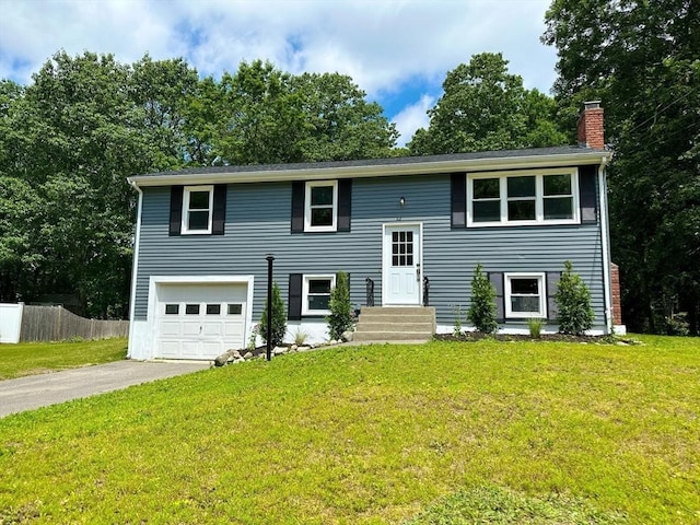 17 Kingsley Rd, Norton, MA 02766 - bi-level home featuring a chimney, driveway, and an attached garage