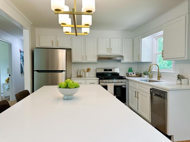 17 Kingsley Rd, Norton, MA 02766 - kitchen featuring stainless steel appliances, under cabinet range hood, a chandelier, light countertops, and white cabinets