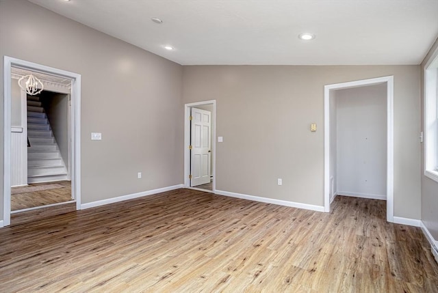 353 Front St, Winchendon, MA 01475 - unfurnished room with lofted ceiling, wood finished floors, stairs, and recessed lighting