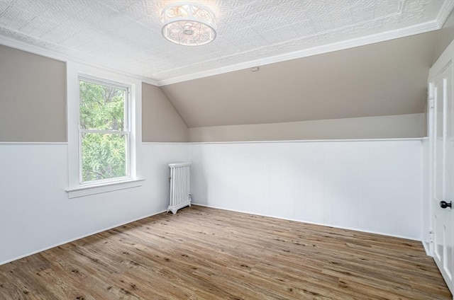 353 Front St, Winchendon, MA 01475 - bonus room featuring radiator heating unit, wood finished floors, and vaulted ceiling
