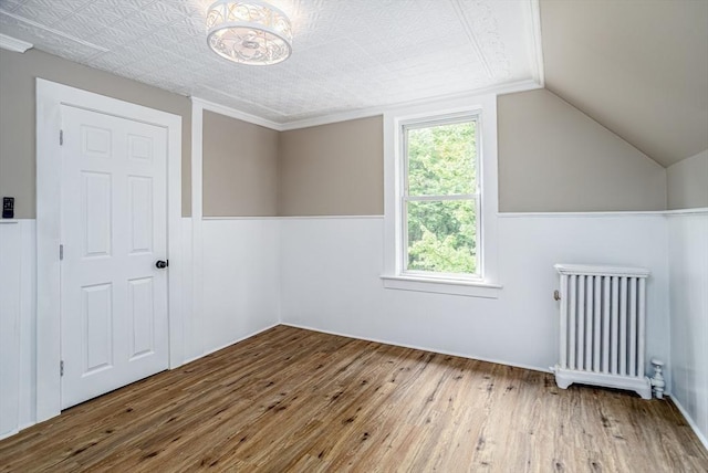 353 Front St, Winchendon, MA 01475 - bonus room featuring radiator heating unit, hardwood / wood-style floors, a wainscoted wall, and lofted ceiling