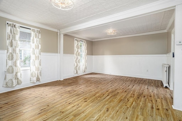 353 Front St, Winchendon, MA 01475 - spare room with wainscoting, radiator, hardwood / wood-style flooring, and ornamental molding
