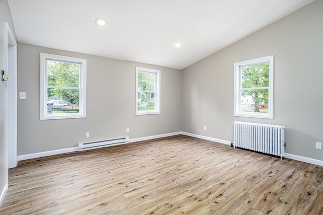 353 Front St, Winchendon, MA 01475 - spare room featuring radiator, baseboard heating, vaulted ceiling, light wood-type flooring, and recessed lighting
