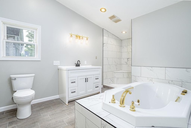 353 Front St, Winchendon, MA 01475 - full bathroom with a whirlpool tub, vanity, wood finished floors, vaulted ceiling, and recessed lighting