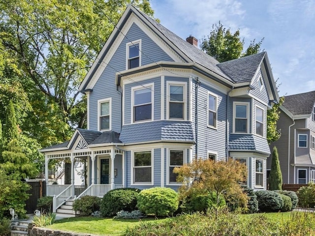 110 Woerd Ave, Waltham, MA 02453 - victorian house with a porch and a chimney
