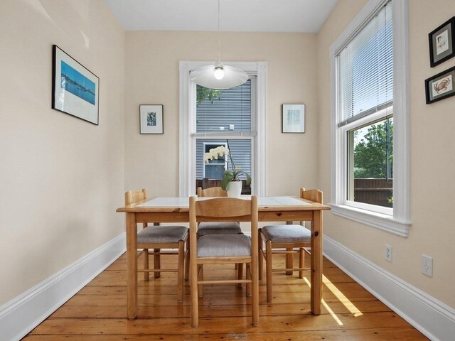 110 Woerd Ave, Waltham, MA 02453 - dining area featuring light wood-type flooring