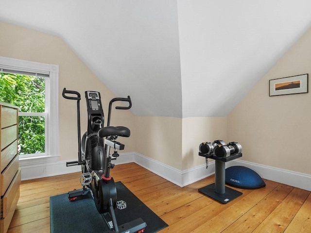 110 Woerd Ave, Waltham, MA 02453 - workout room with hardwood / wood-style flooring and vaulted ceiling