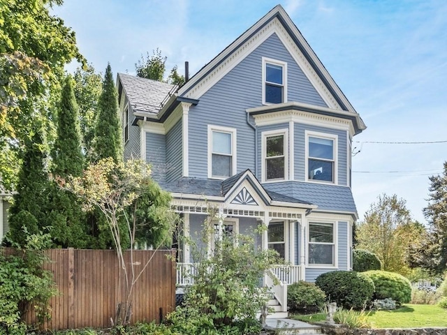 110 Woerd Ave, Waltham, MA 02453 - victorian-style house featuring a porch