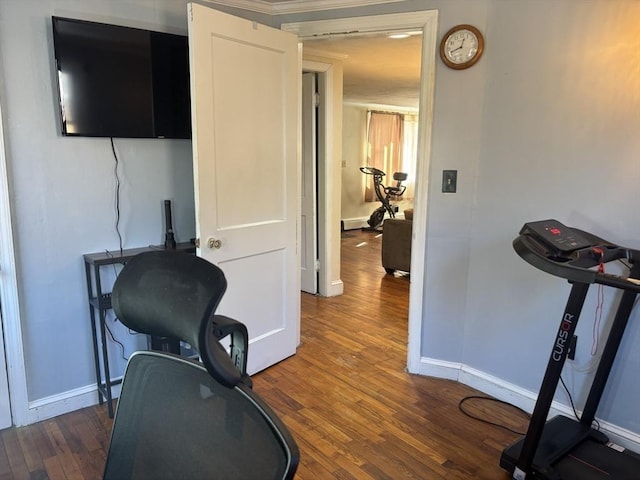 workout room featuring dark wood-type flooring