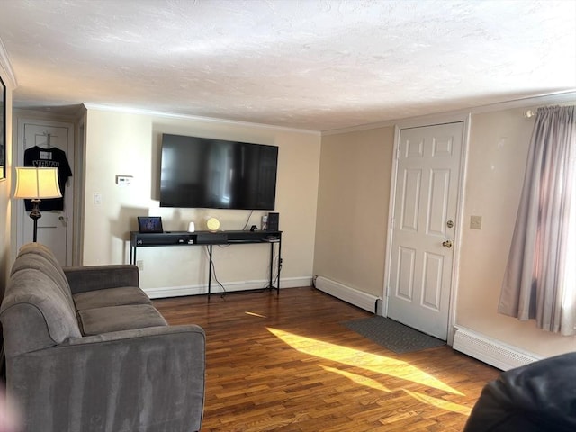 living room featuring dark wood-type flooring, a baseboard radiator, crown molding, and a textured ceiling