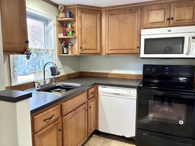 kitchen featuring white appliances and sink