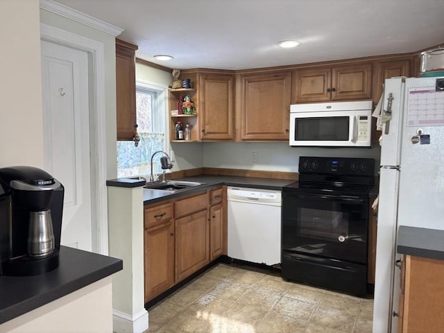 kitchen featuring sink and white appliances