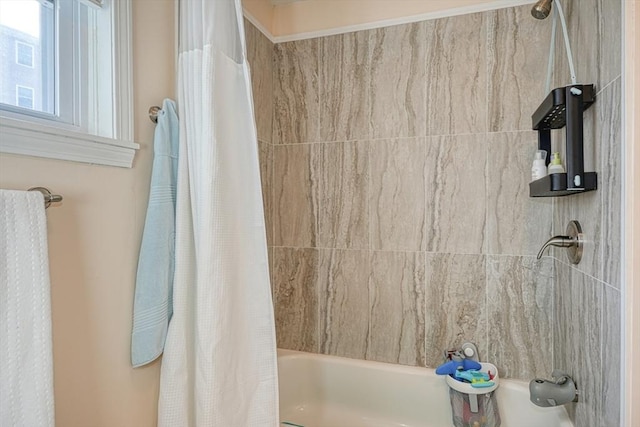 bathroom featuring shower / bath combo with shower curtain