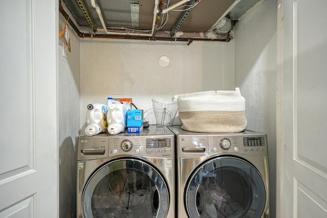 laundry room featuring separate washer and dryer