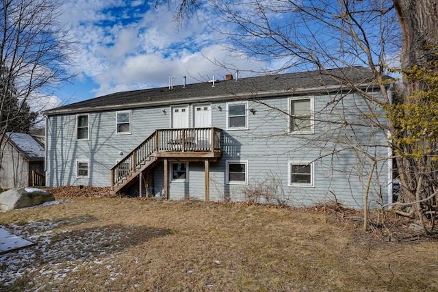 back of property with a wooden deck