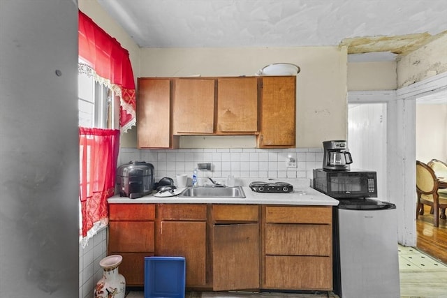 kitchen featuring backsplash and sink