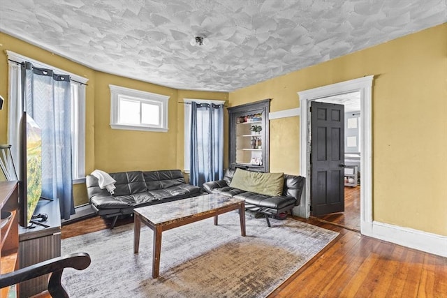 sitting room featuring dark wood-type flooring