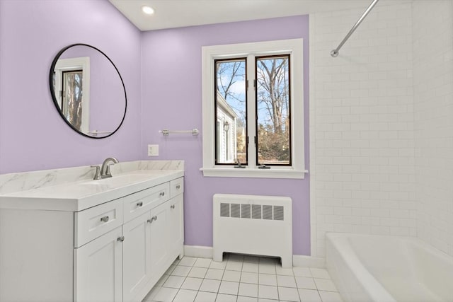 bathroom with tile patterned flooring, radiator, baseboards, recessed lighting, and vanity