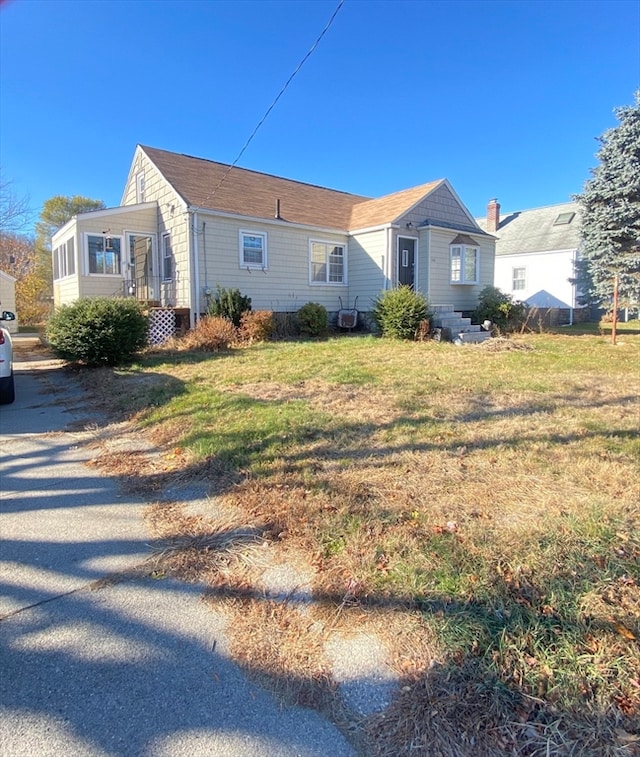 exterior space featuring a front lawn