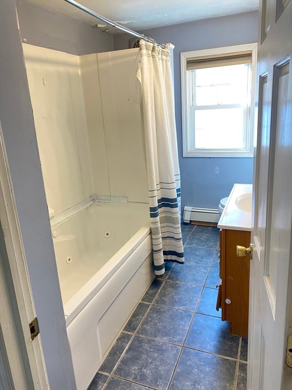 bathroom featuring tile patterned flooring, shower / bath combo, vanity, and a baseboard radiator